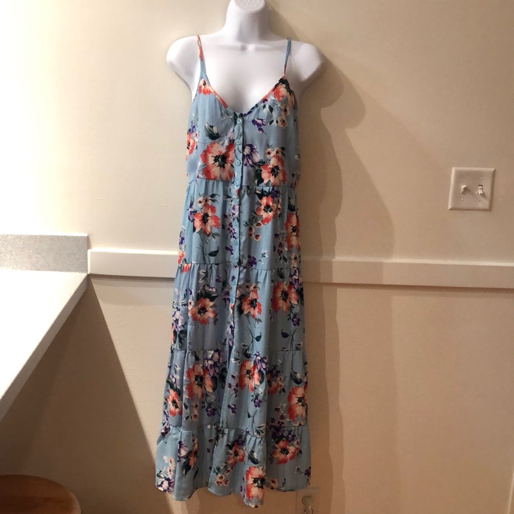 Floral sun dress. Button front. Adjustable straps.
